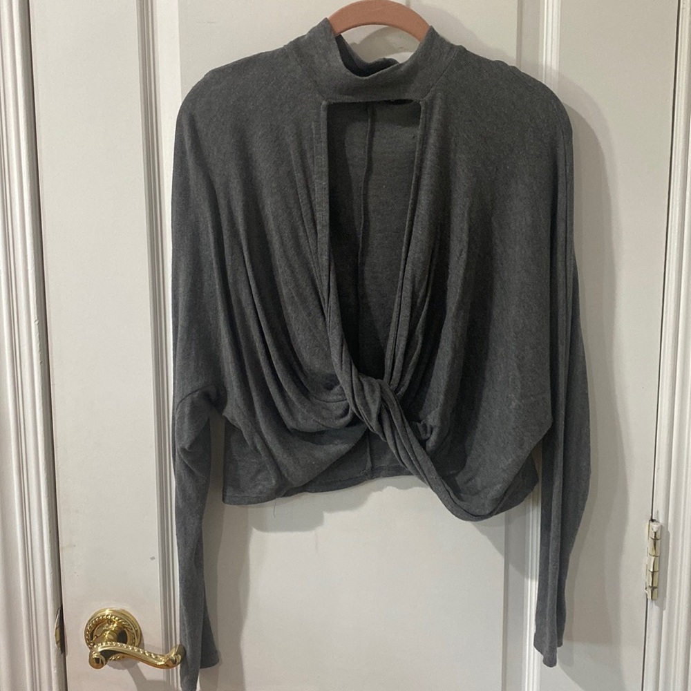 Grey sweater with center cutout.
